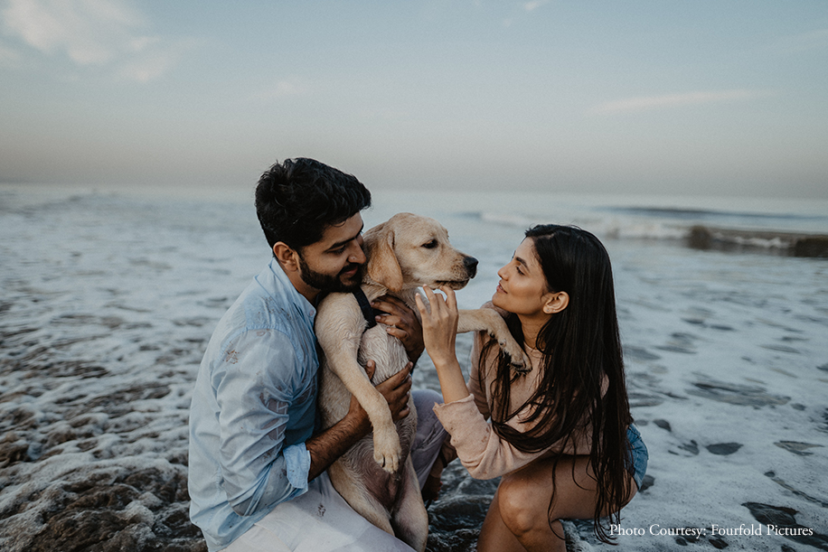 A couple celebrated their love along with their adorable dog in tow, at the Juhu Beach with a candid photoshoot