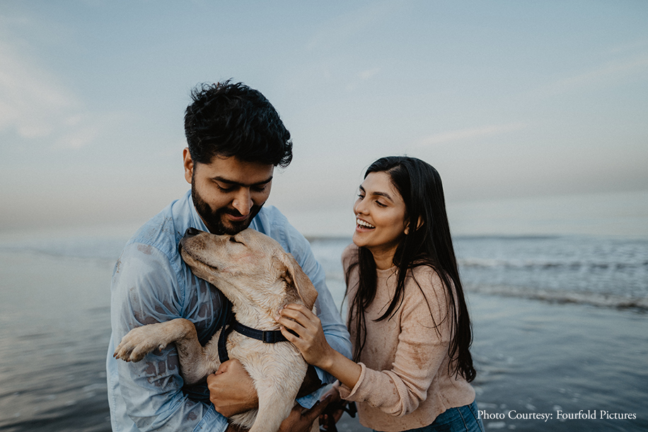 A couple celebrated their love along with their adorable dog in tow, at the Juhu Beach with a candid photoshoot