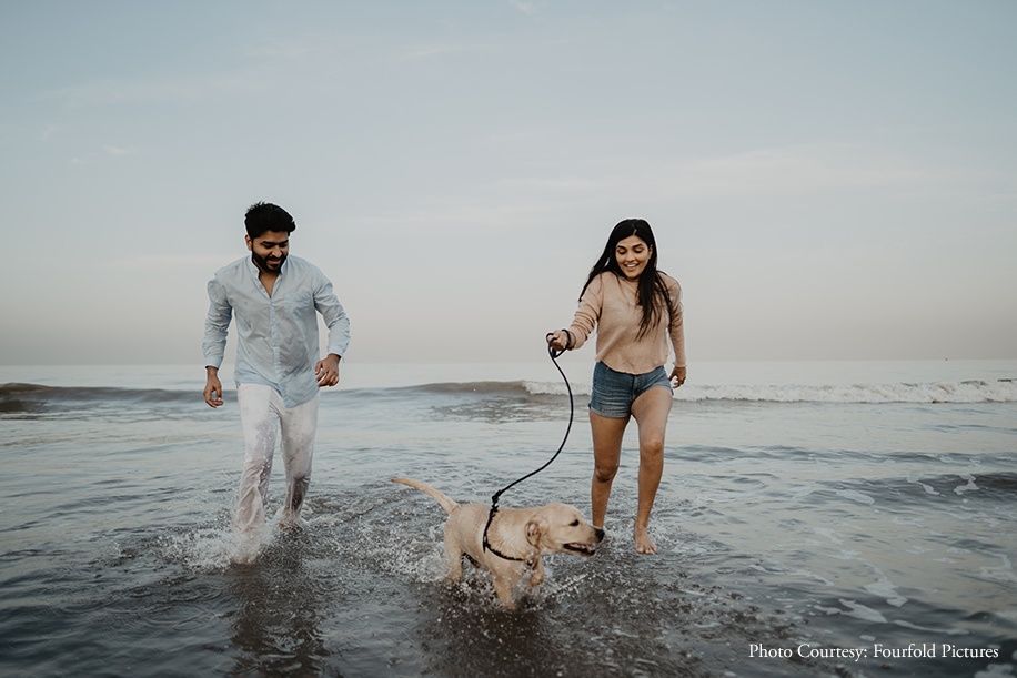 A couple celebrated their love along with their adorable dog in tow, at the Juhu Beach with a candid photoshoot