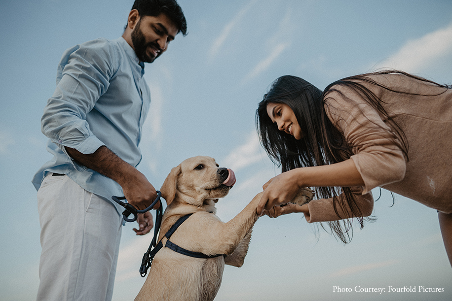 A couple celebrated their love along with their adorable dog in tow, at the Juhu Beach with a candid photoshoot
