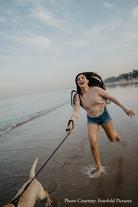 A couple celebrated their love along with their adorable dog in tow, at the Juhu Beach with a candid photoshoot