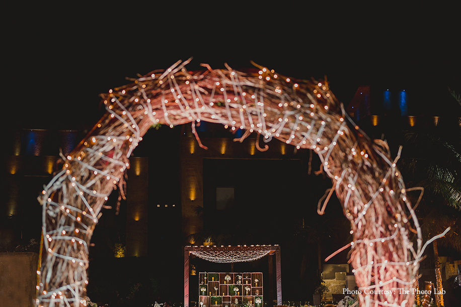 Twinkling lights, classy wooden and floral reception decor