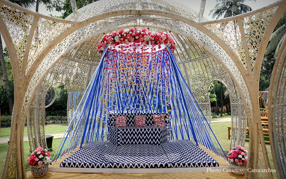 bright blue seating arrangements under a ivory dome for bride's mehndi