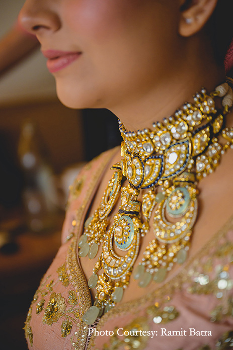 The bride wore a blush pink Sabyasachi lehenga with rich Polki and meenakari jewelry for the wedding