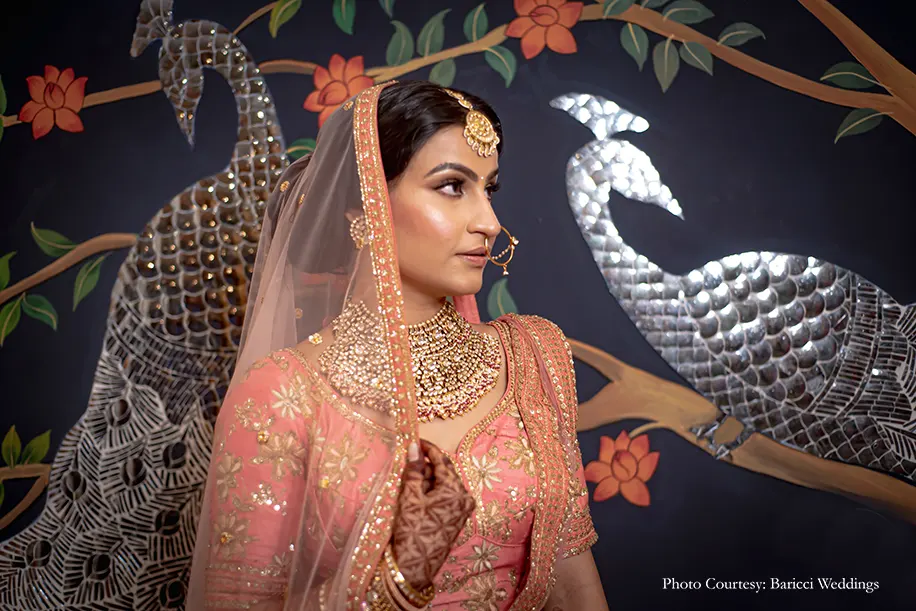 Bride wearing rose-pink lehenga by Frontier Raas
