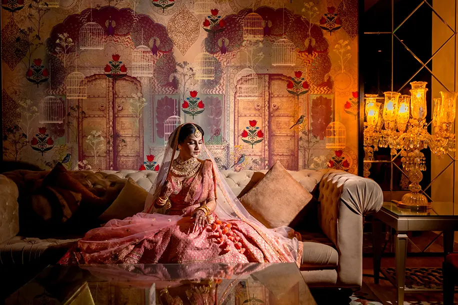 Bride wearing rose-pink lehenga by Frontier Raas