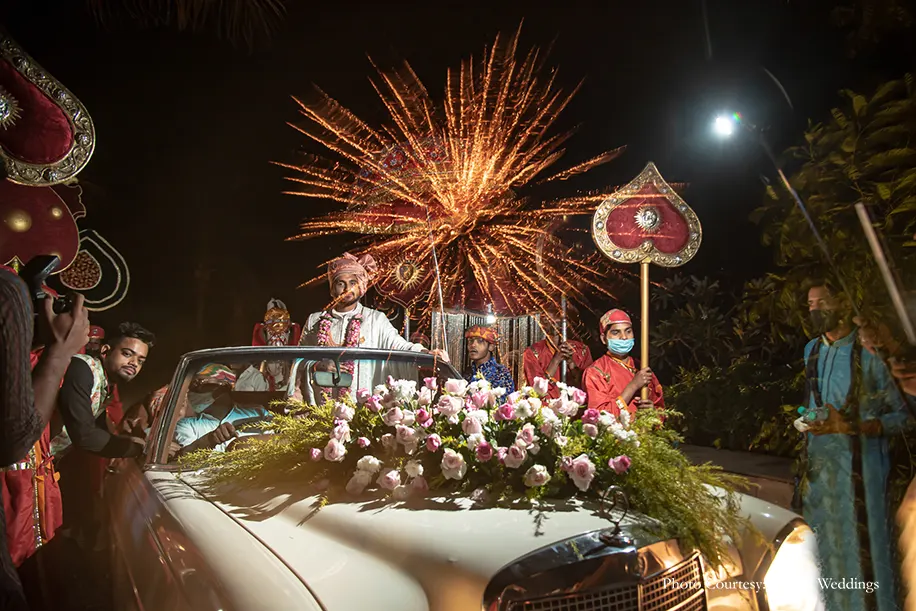 Groom's entry in a vintage car