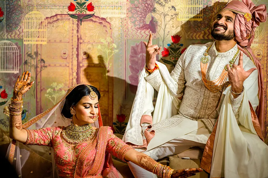 Couple posing in wedding outfit