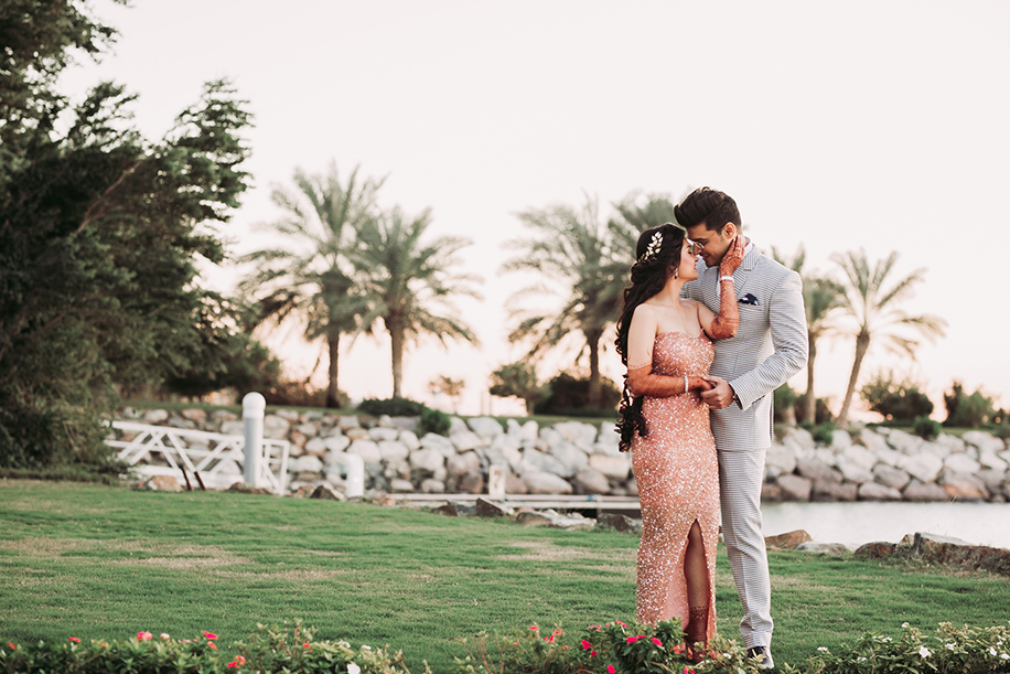 bride gold glitter body hugging dress and groom in checked three piece suit bride gold glitter body hugging dress and groom in checked three piece suit