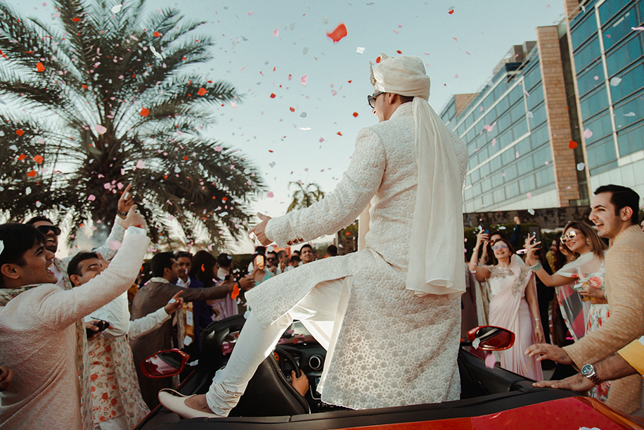 Groom entry entered with his baraat in a red Ferrari at Abu Dhabi Groom entry entered with his baraat in a red Ferrari at Abu Dhabi