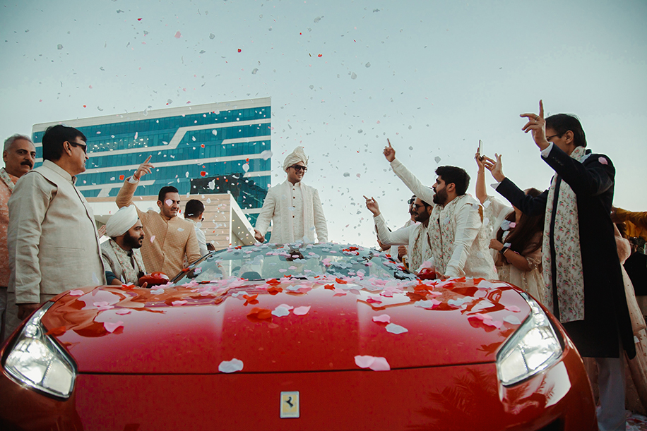 Groom entry entered with his baraat in a red Ferrari at Abu Dhabi Groom entry entered with his baraat in a red Ferrari at Abu Dhabi