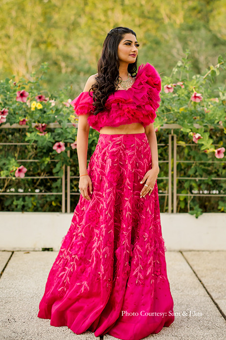 Bride in Hot pink ruffled crop top and skirt by Shriya Som