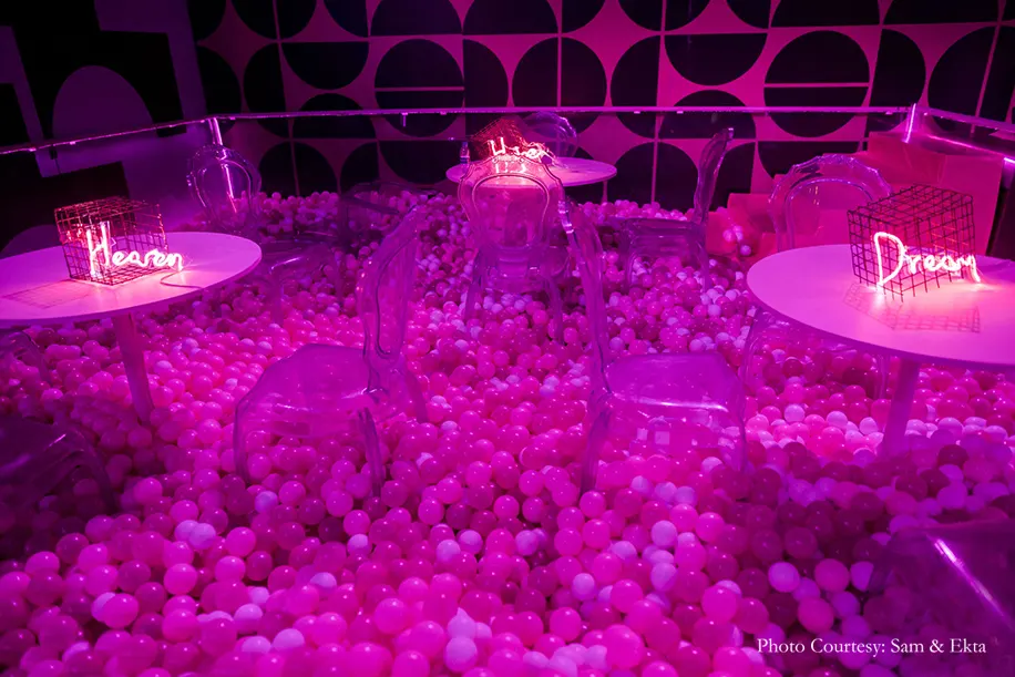 Neon lights, balloons, a ball pit and a bouncy castle decor for After Party