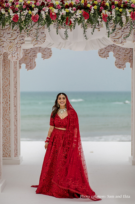 Bride in Red Sabyasachi lehenga at Oman
