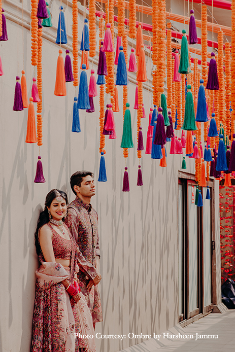 colorful mehendi theme paired with bright orange marigolds