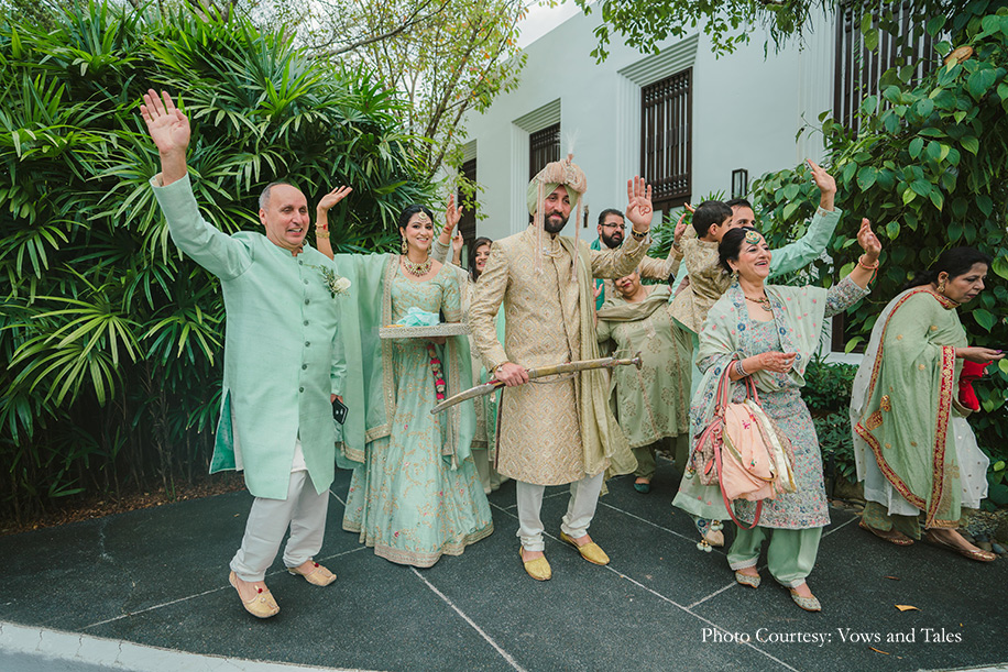 Groom in off white sherwani paired with a sage green turban for baraat at thailand