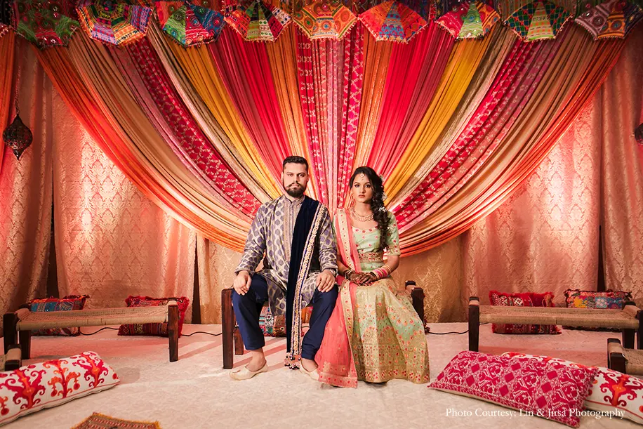bride in pista green lehnga and groom in blue kurta for the sangeet