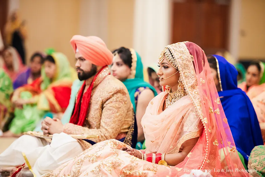 Couple in peach outfit for the sikh wedding