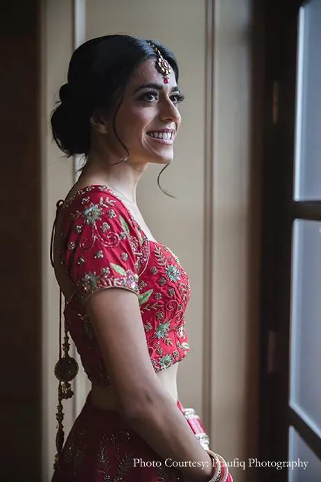 Bride wearing red embroidery lehenga