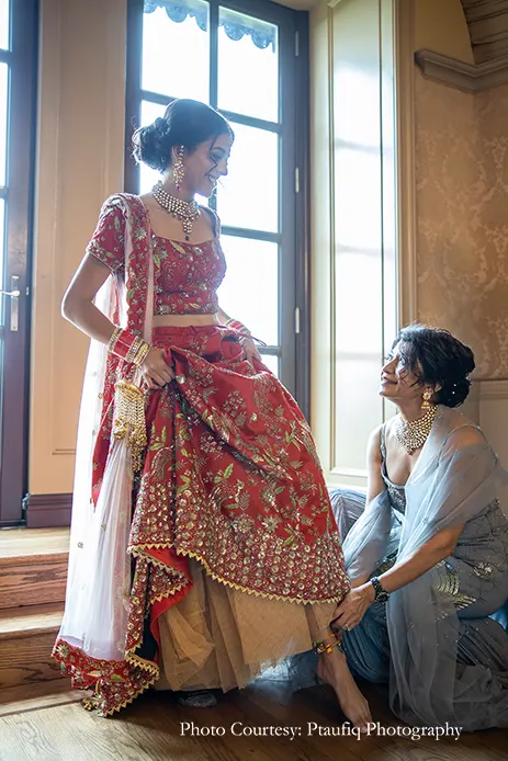 Bride wearing red embroidery lehenga