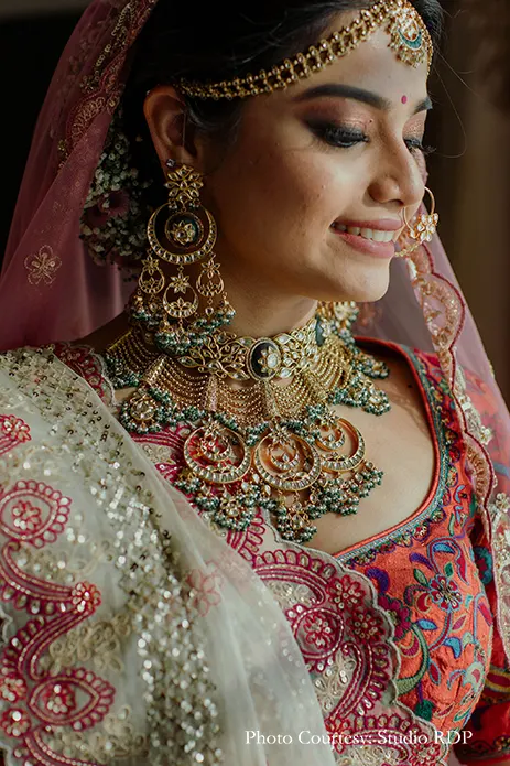Bride wearing multicolored lehengafor the wedding