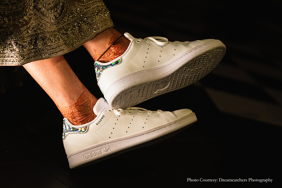 Bride wearing Adidas Stan Smiths for her cocktail