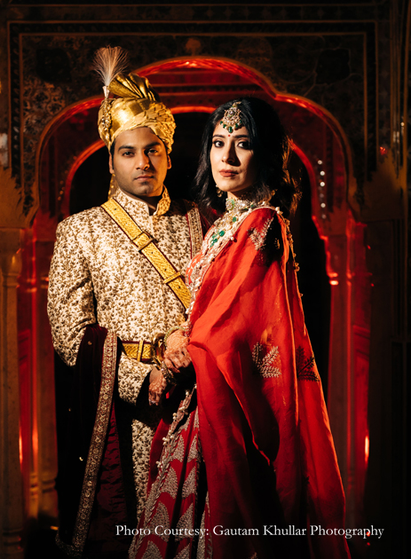 Red lehenga by Anamika Khanna and white and gold sherwani from SVA By Sonam & Paras Modi