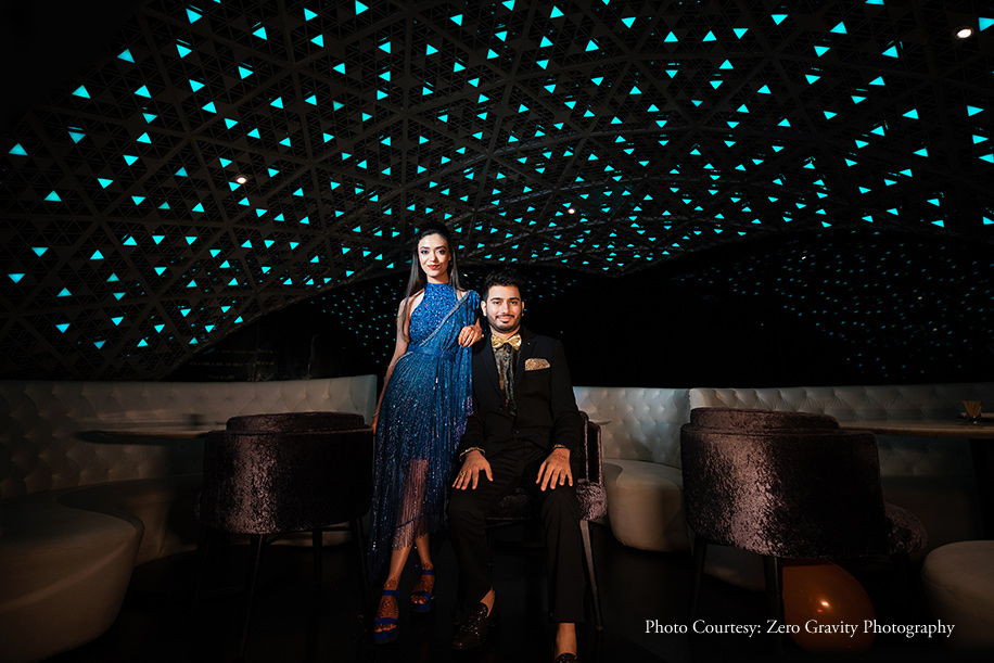 Bride in blue dress by Bella Figura Couture by Mamta and groom in gold shimmering tuxedo for the After Party