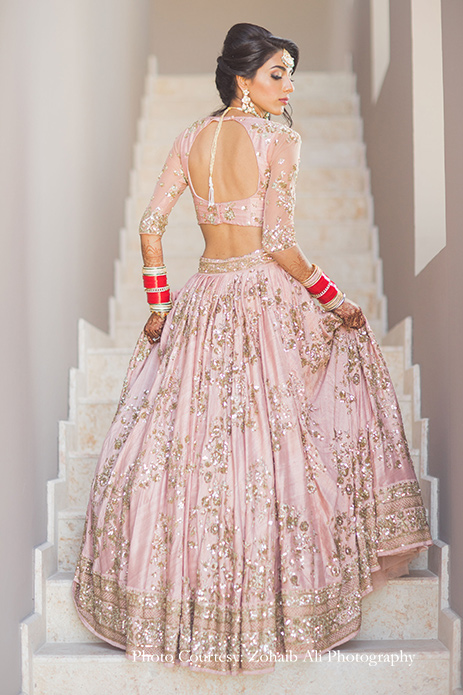 Bride wearing delicate blush lehenga by Astha Narang for Anand Karaj