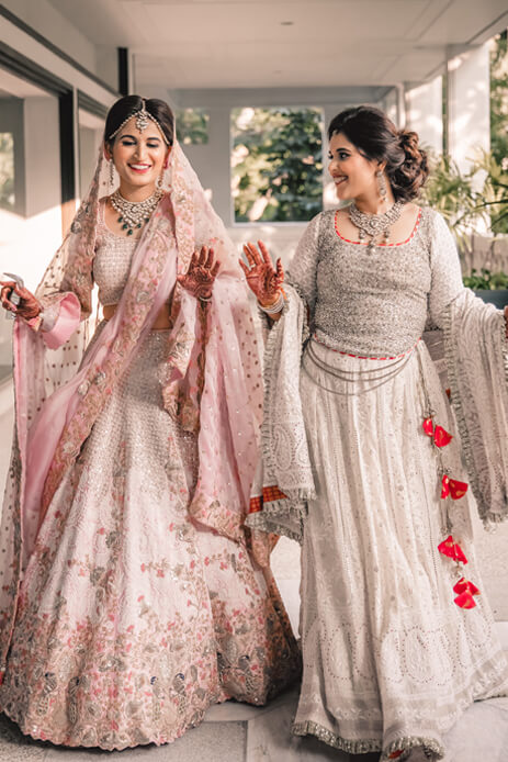 bride dancing in excitement in her Anamika Khanna lehenga moments