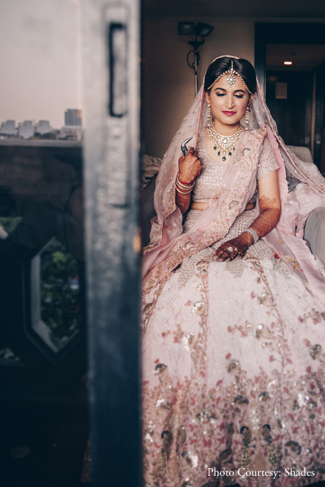 bride dancing in excitement in her Anamika Khanna lehenga moments