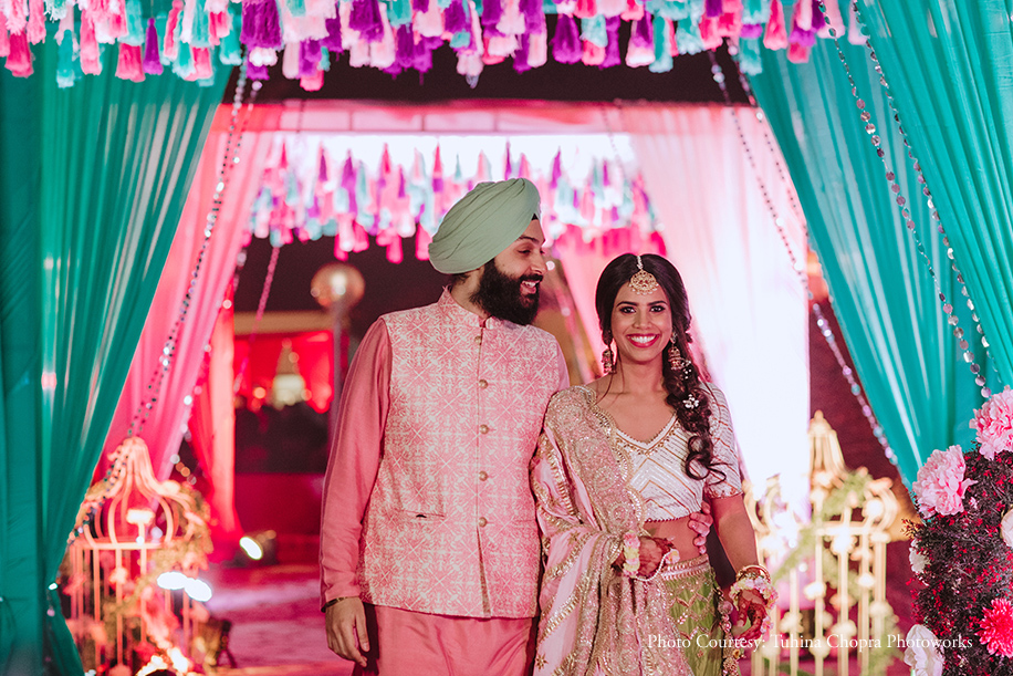 The groom matched the décor in blush and blue, while the bride looked sultry in a champagne and blush lehenga.