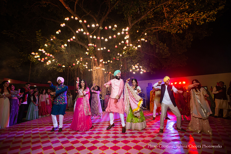 outdoors sundowner mehndi celebration with pink and blue shimmering lights decor