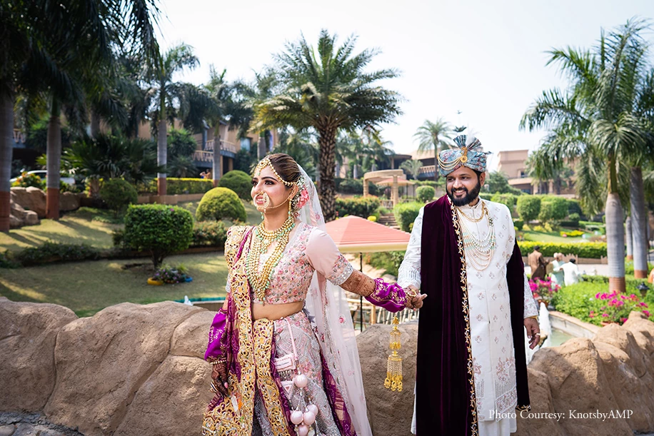 Bride in traditional gharchola and a pastel lehenga by Heena Designer Studio and Groom outfit by Tulsi Studio