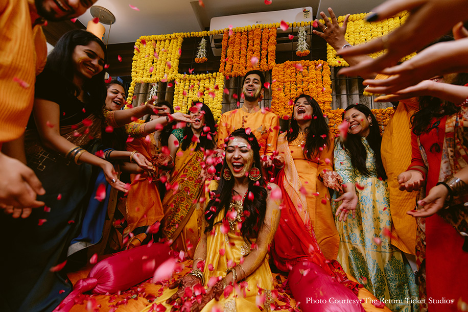 Yellow and orange haldi outfit for Gujrati ‘pithi’ ceremony