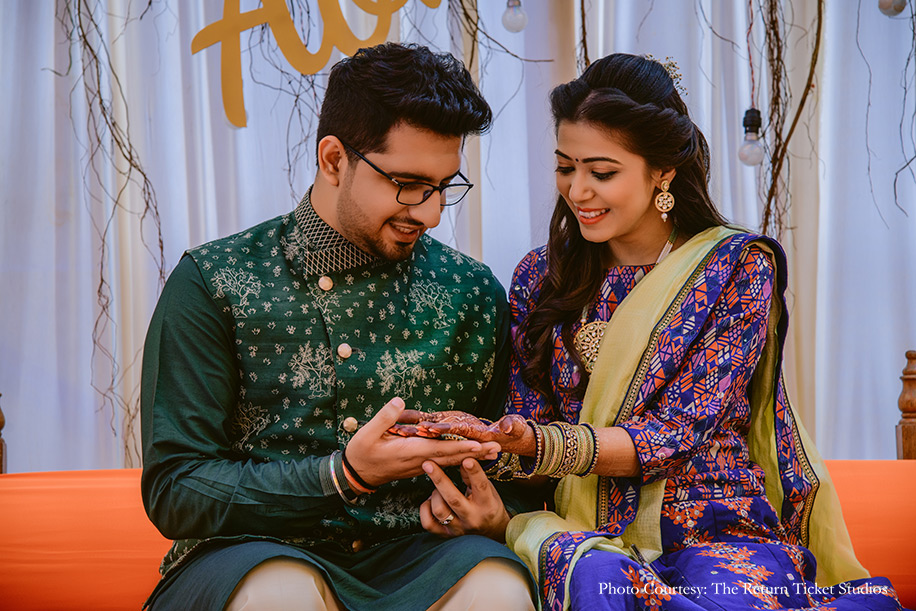 Bride in blue lehnga and groon in nehru jacket for mehndi ceremony