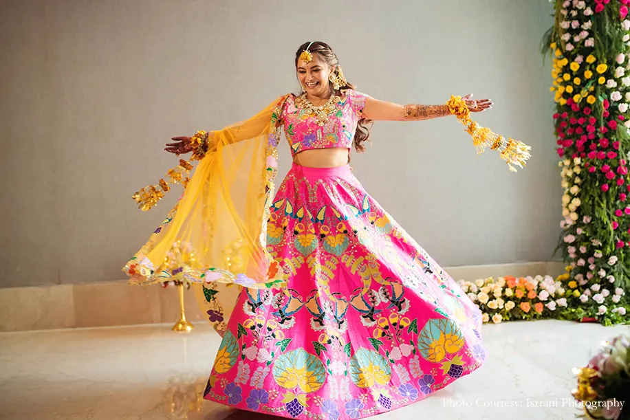 Bride wearing pink lehenga for the haldi