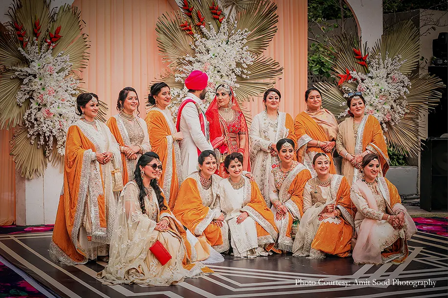 red safa and bride wearing red lehenga for the sikh wedding
