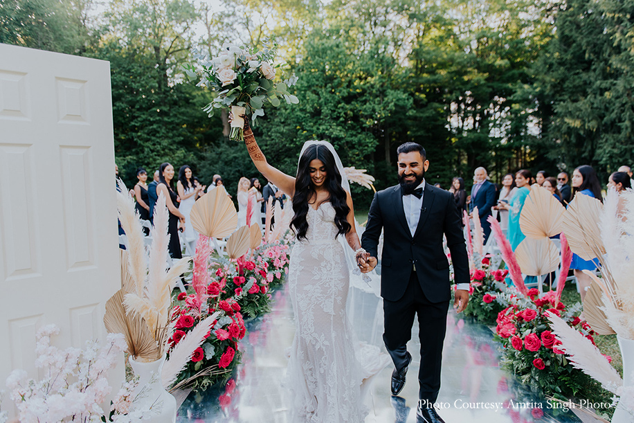 Bride in a show-stopping mermaid-cut white lace gown with a nude underlay and Groom wearing Giorgio Armani suit for civil ceremony