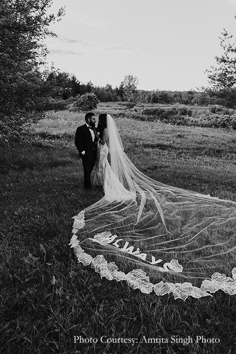 Bride in a show-stopping mermaid-cut white lace gown with a nude underlay and Groom wearing Giorgio Armani suit for civil ceremony