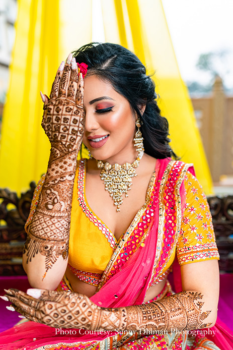 Yellow and Pink Lehenga with floral jewelry for mehendi
