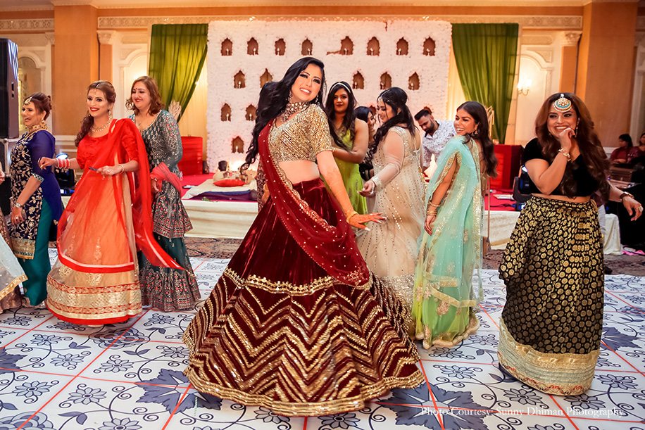 Bride wearing maroon velvet lehenga with mirror and gotta patti work for sufi themed sangeet