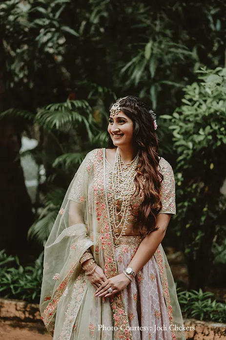 Bride wearing pista green lehenga with o=peach embroidery and rani haar for the civil wedding