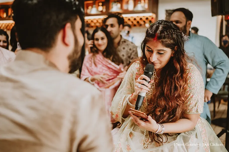 Bride wearing pista green lehenga with o=peach embroidery and rani haar and groom wearing ivory sherwani by manish malhotra for the civil wedding