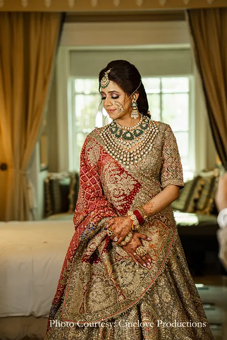 Bride in gold lehenga for anand karaj