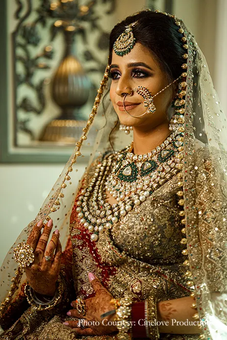 Bride in gold lehenga for anand karaj