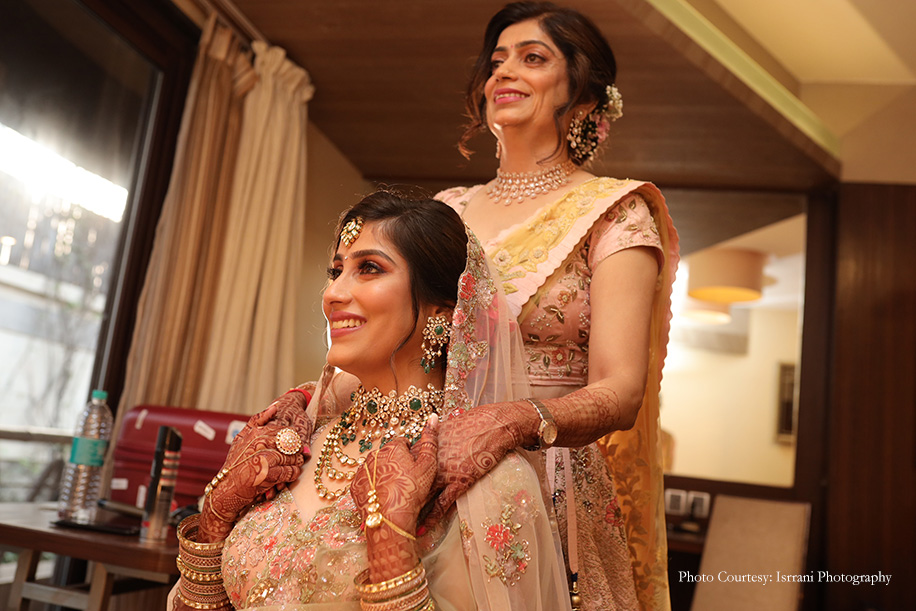 Bride in Beige and pink embroidered floral lehenga