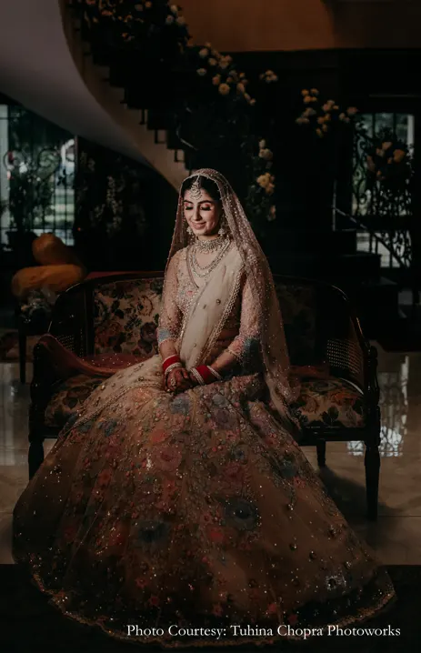 Bride in a Tarun Tahiliani ensemble with delicate floral motifs and appliqué-work