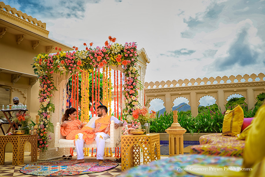 vibrant and minimalistic décor of flowers and props for haldi