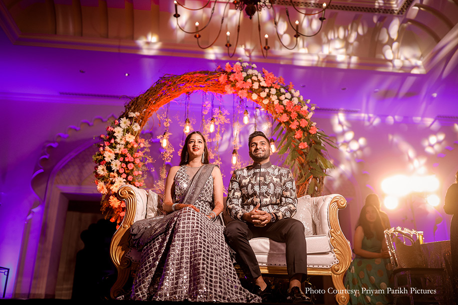 couple shimmered in matching shades of silver and blue for the sangeet